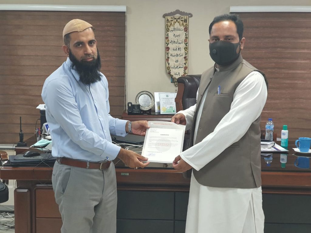 M R Munwer Mr. Hassan Ali (DGM Production) presenting promotion letter to Mr ...